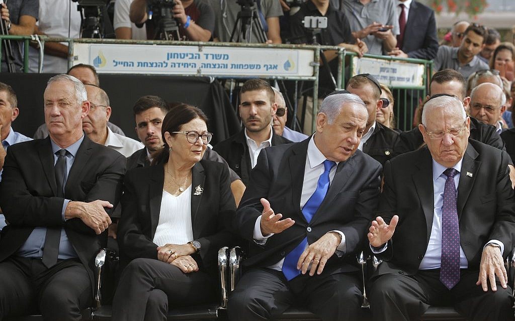From R to L: President Reuven Rivlin, Prime Minister Benjamin Netanyahu, Supreme Court Chief Justice Esther Hayut and Blue and White party chairman Benny Gantz at a memorial ceremony for late president Shimon Peres, at Mount Herzl in Jerusalem on September 19, 2019. (Gil Cohen-Magen/AFP) From R to L: President Reuven Rivlin, Prime Minister Benjamin Netanyahu, Supreme Court Chief Justice Esther Hayut and Blue and White party chairman Benny Gantz at a memorial ceremony for late president Shimon Peres, at Mount Herzl in Jerusalem on September 19, 2019. (Gil Cohen-Magen/AFP)