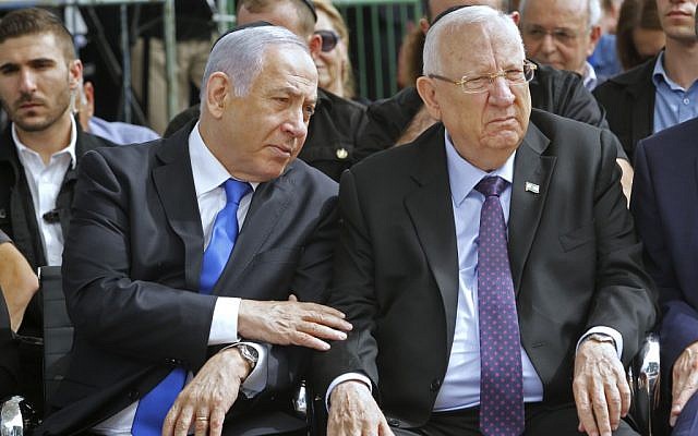 Prime Minister Benjamin Netanyahu (L) and President Reuven Rivlin attend a memorial ceremony for late president Shimon Peres, at Mount Herzl cemetery in Jerusalem on September 19, 2019. (GIl Cohen-Magen/AFP)