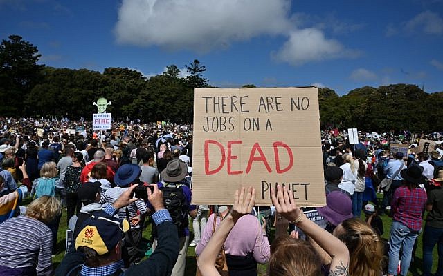 People attend a protest as part of the world's largest climate strike in Sydney on September 20, 2019. (PETER PARKS / AFP)