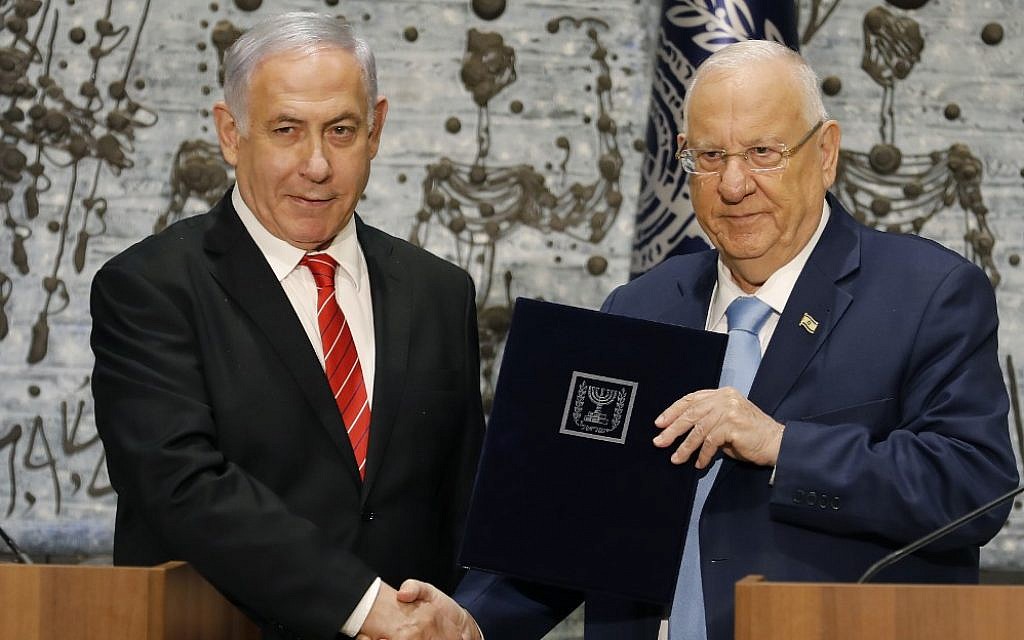 President Reuven Rivlin, right  tasks Prime Minister Benjamin Netanyahu with forming a new government, during a press conference at the President's Residence, in Jerusalem on September 25, 2019. (Menahem Kahana/AFP)