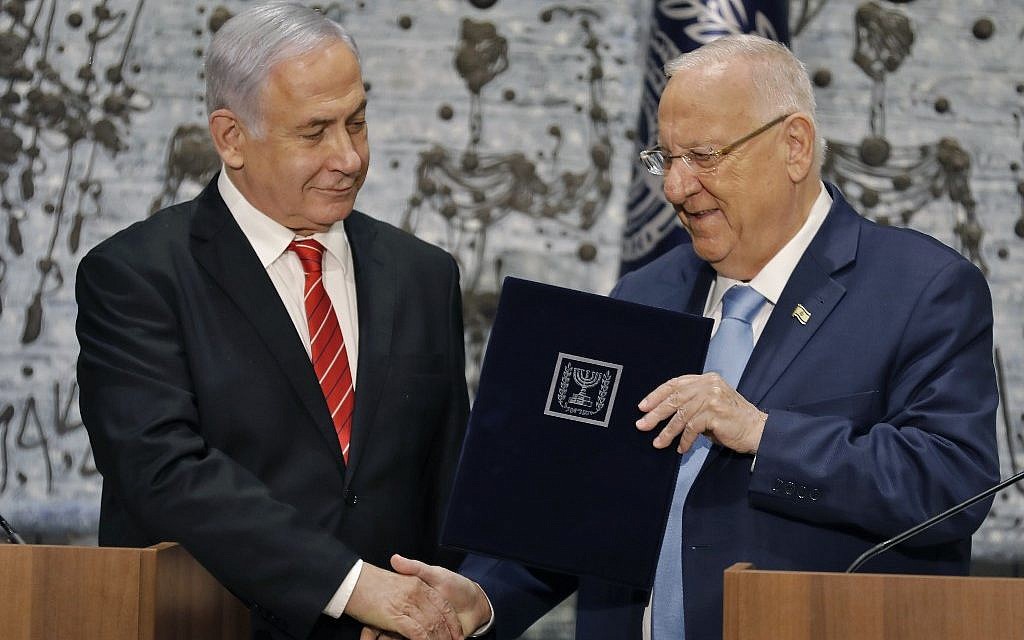 President Reuven Rivlin (R) tasks Prime Minister Benjamin Netanyahu with forming a new government, during a press conference at the President's Residence in Jerusalem on September 25, 2019. (Menahem Kahana/AFP) President Reuven Rivlin (R) tasks Prime Minister Benjamin Netanyahu with forming a new government, during a press conference at the President's Residence in Jerusalem on September 25, 2019. (Menahem Kahana/AFP)