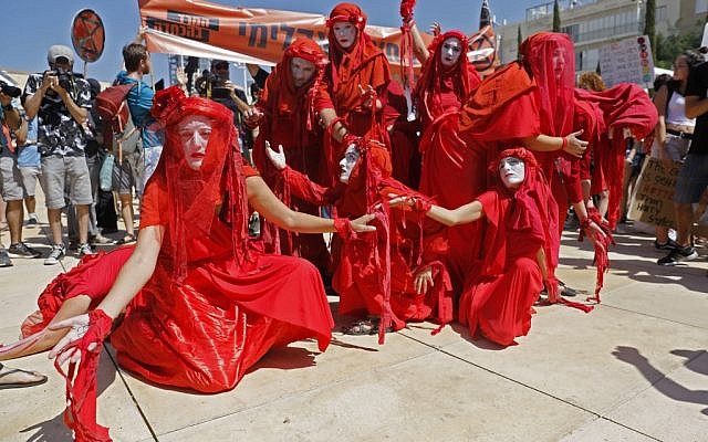Activists of Extinction Rebellion take part in a Global Climate Strike in the Israeli coastal city of Tel Aviv on September 27, 2019 against inaction on climate change. (AHMAD GHARABLI / AFP)