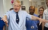 Britain's Prime Minister Boris Johnson gestures during a visit to North Manchester General Hospital in north-west England on September 29, 2019, ahead of the opening day of the annual Conservative Party conference. (Andy Stenning / POOL / AFP)