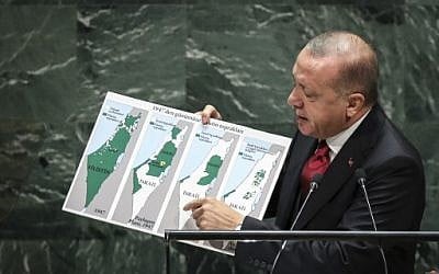 President of Turkey Recep Tayyip Erdogan holds up a map of Israel since 1947 showing what he says are expanding Israeli borders while speaking to the United Nations General Assembly at UN headquarters on September 24, 2019 in New York City. (Drew Angerer/Getty Images/AFP)