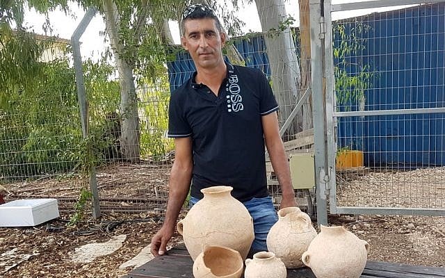 Ahmed Nassar Yassin with 4,500-year-old artifacts he discovered in a burial cave near Araba in northern Israel. (Nir Distelfeld/Israel Antiquities Authority) Ahmed Nassar Yassin with 4,500-year-old artifacts he discovered in a burial cave near Araba in northern Israel. (Nir Distelfeld/Israel Antiquities Authority)