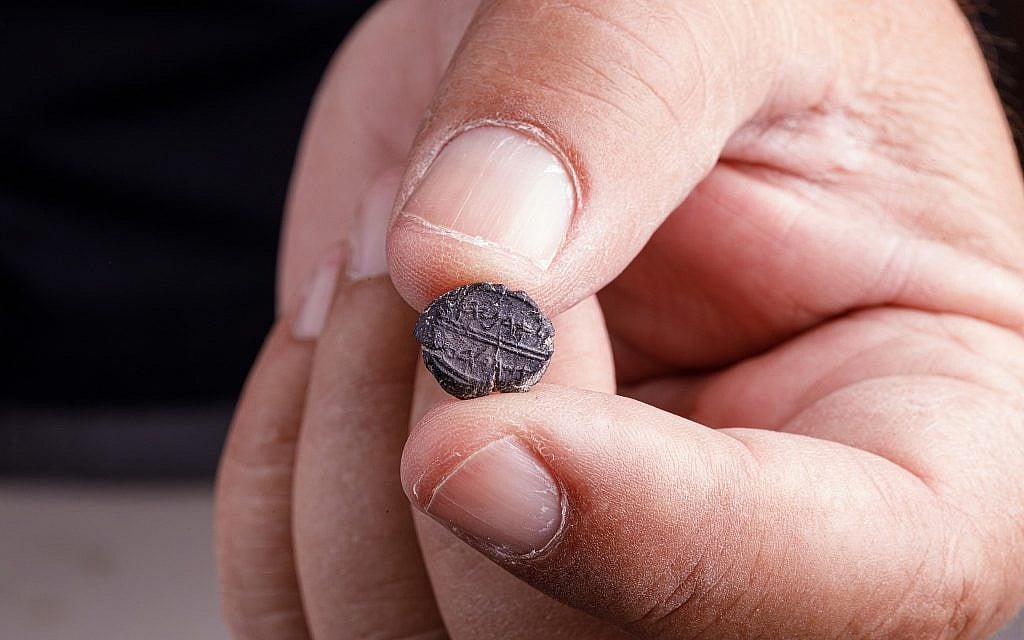 A small 7th century BCE clay sealing reading 'Belonging to Adoniyahu, Royal Steward,' recently discovered in the City of David's sifting project, taken from earth excavated under Robinson's Arch. (Eliyahu Yanai/Courtesy City of David)