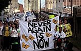 Jewish Never Again Action activists march across the Longfellow Bridge between Boston and Cambridge, Massachusetts, toward Amazon's Cambridge office after rallying at the New England Holocaust Memorial, September. 5, 2019. (Barry Chin/The Boston Globe via Getty Images via JTA)
