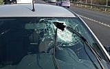 The windshield of a car whose driver was hit by a rock and moderately injured in the West Bank, Friday, September 20, 2019 (Rescue services)