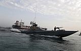 In this July 21, 2019 file photo, a speedboat of Iran's Revolutionary Guard moves around a British-flagged oil tanker, the Stena Impero, which was seized by the Guard, in the Iranian port of Bandar Abbas. (Hasan Shirvani/Mizan News Agency via AP, File)