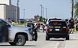 Odessa and Midland police and sheriff's deputies surround the area behind Cinergy movie theater in Odessa, Texas, August 31, 2019, after reports of gunfire (Tim Fischer/Midland Reporter-Telegram via AP)