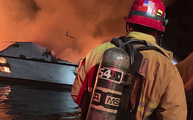 In this photo provided by the Ventura County Fire Department, VCFD firefighters respond to a boat fire off the coast of southern California, September 2, 2019. (Ventura County Fire Department via AP)