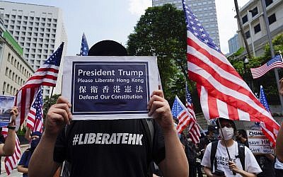 Protesters waves United States flags and placards during a protest in Hong Kong,  September 8, 2019. (Vincent Yu/AP)