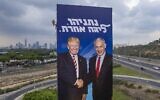 A worker hangs an election campaign billboard of the Likud party that shows Prime Minister Benjamin Netanyahu, right, shaking hands with US President Donald Trump, in Tel Aviv, September 8, 2019. The slogan reads: 'Netanyahu -- a league of his own.' (AP/Oded Balilty)