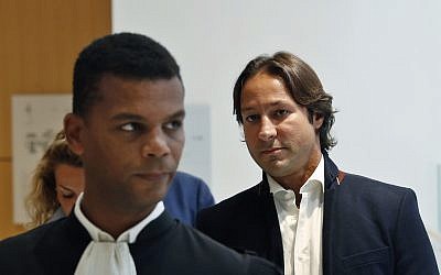 Saudi princess Hassa bint Salman's bodyguard Raina Said, right, arrives at the courthouse with his lawyer Yassine Bouzrou, left, in Paris, September 12, 2019. The only daughter of Saudi Arabia's King Salman has been found guilty by a Paris court of charges that she ordered her bodyguard to detain and strike a plumber for taking photos at the Saudi royal family's apartment in the French capital. (AP Photo/Thibault Camus)
