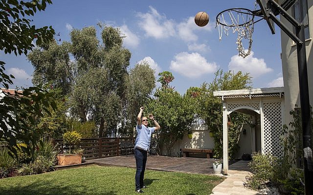 In this Friday, Sept. 13, 2019 photo, Blue and White party leader and former IDF chief of staff Benny Gantz throws the ball during a photoshoot at his garden in his home in Rosh Haayin, Israel. (AP Photo/Oded Balilty) In this Friday, Sept. 13, 2019 photo, Blue and White party leader and former IDF chief of staff Benny Gantz throws the ball during a photoshoot at his garden in his home in Rosh Haayin, Israel. (AP Photo/Oded Balilty)