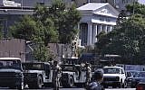 Lebanese Army soldiers stand guard outside a military court where an arrest warrant was issued for Lebanese-American Amer Fakhoury, who confessed he'd worked for Israel during its military presence in Lebanon for nearly two decades, in Beirut, Lebanon, September 17, 2019. (AP Photo/Bilal Hussein)