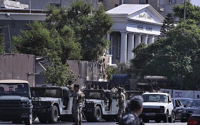 Lebanese Army soldiers stand guard outside a military court where an arrest warrant was issued for Lebanese-American Amer Fakhoury, who confessed he'd worked for Israel during its military presence in Lebanon for nearly two decades, in Beirut, Lebanon, September 17, 2019. (AP Photo/Bilal Hussein) Lebanese Army soldiers stand guard outside a military court where an arrest warrant was issued for Lebanese-American Amer Fakhoury, who confessed he'd worked for Israel during its military presence in Lebanon for nearly two decades, in Beirut, Lebanon, September 17, 2019. (AP Photo/Bilal Hussein)