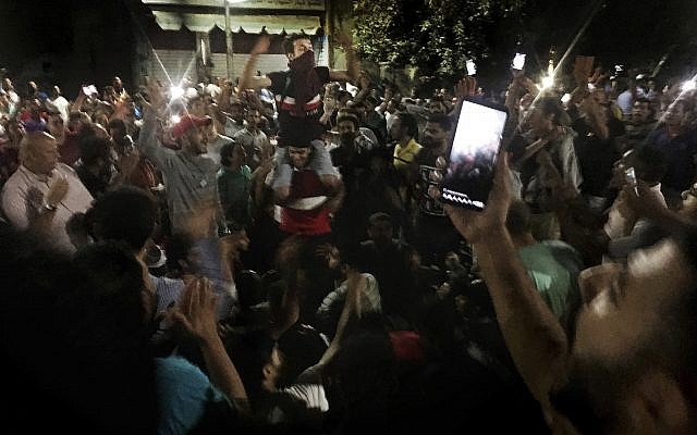 Protesters chant slogans against the regime in Cairo, Egypt, September 21, 2019. Dozens of people held a rare protest in Cairo during which they called on Egyptian President Abdel-Fattah el-Sissi to quit. (AP Photo/Nariman El-Mofty) Protesters chant slogans against the regime in Cairo, Egypt, September 21, 2019. Dozens of people held a rare protest in Cairo during which they called on Egyptian President Abdel-Fattah el-Sissi to quit. (AP Photo/Nariman El-Mofty)