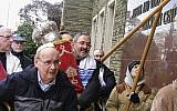 This 2017 photo provided by fellow congregant Barry Werber shows Richard Gottfried carrying a Torah outside the Tree Of Life building in Pittsburgh. Gottfried was among the 11 killed by an anti-Semitic gunman on October 27, 2018. (Barry Werber via AP)