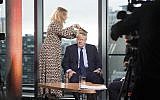 British Prime Minister Boris Johnson has his hair combed as he prepares to appear on a TV political show at Media City in Salford, England, before opening the Conservative party annual conference on September 29, 2019. (Stefan Rousseau/PA via AP)
