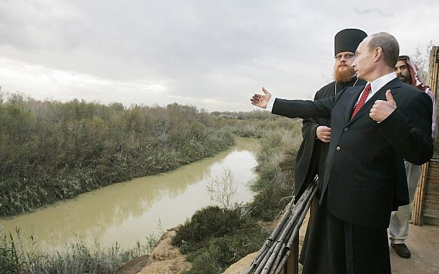 Russian President Vladimir Putin, accompanied by Archimandrite Tikhon, head of the Russian Orthodox mission in Jerusalem, and Jordan's Prince Ghazi, visits the Jordan River at the official baptism site of Jesus in the Jordan Valley during a visit to the holy Christian site, February 13, 2007. (AP Photo/ITAR-TASS, Dmitry Astakhov, Presidential Press Service) Russian President Vladimir Putin, accompanied by Archimandrite Tikhon, head of the Russian Orthodox mission in Jerusalem, and Jordan's Prince Ghazi, visits the Jordan River at the official baptism site of Jesus in the Jordan Valley during a visit to the holy Christian site, February 13, 2007. (AP Photo/ITAR-TASS, Dmitry Astakhov, Presidential Press Service)