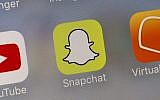 This Aug. 9, 2017 photo shows the Snapchat app. (AP Photo/Richard Drew)