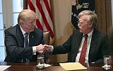 US President Donald Trump, left, shakes hands with national security adviser John Bolton in the Cabinet Room of the White House in Washington, April 9, 2018. (AP Photo/Susan Walsh)