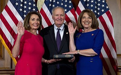 House Speaker Nancy Pelosi of Calif., administers the House oath of office to Rep. Susan Davis, D-Calif., during aceremonial swearing-in on Capitol Hill in Washington, Thursday, Jan. 3, 2019, during the opening session of the 116th Congress. (AP Photo/Jose Luis Magana)