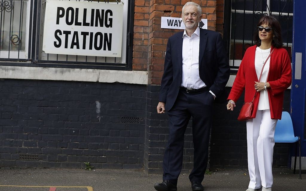 Illustrative: MP Jeremy Corbyn leader of Britain's opposition Labour Party and his wife Laura Alvarez leaves a polling station after voting in the European Elections in London, May 23, 2019. (Kirsty Wigglesworth/AP) Illustrative: MP Jeremy Corbyn leader of Britain's opposition Labour Party and his wife Laura Alvarez leaves a polling station after voting in the European Elections in London, May 23, 2019. (Kirsty Wigglesworth/AP)