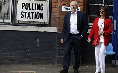 Illustrative: MP Jeremy Corbyn leader of Britain's opposition Labour Party and his wife Laura Alvarez leaves a polling station after voting in the European Elections in London, May 23, 2019. (Kirsty Wigglesworth/AP)