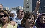 A Palestinian woman chants slogans during a rally in front of the prime minister's office, in the West Bank city of Ramallah,September 2. 2019. (AP Photo/Nasser Nasser)