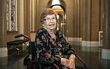 In this September 11, 2019, photo, Holocaust survivor Helga Melmed poses for a portrait during an event celebrating the 50th anniversary of a program for people expelled and persecuted by the Nazis and bringing tens of thousands of them back to their home city for one-week trips in Berlin. (Paul Zinken/dpa via AP)
