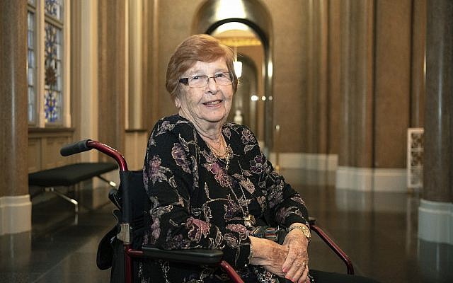 In this September 11, 2019, photo, Holocaust survivor Helga Melmed poses for a portrait during an event celebrating the 50th anniversary of a program for people expelled and persecuted by the Nazis and bringing tens of thousands of them back to their home city for one-week trips in Berlin. (Paul Zinken/dpa via AP) In this September 11, 2019, photo, Holocaust survivor Helga Melmed poses for a portrait during an event celebrating the 50th anniversary of a program for people expelled and persecuted by the Nazis and bringing tens of thousands of them back to their home city for one-week trips in Berlin. (Paul Zinken/dpa via AP)