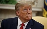 US President Donald Trump listens to a reporter's question in the Oval Office of the White House, in Washington, September 16, 2019. (Alex Brandon/AP)