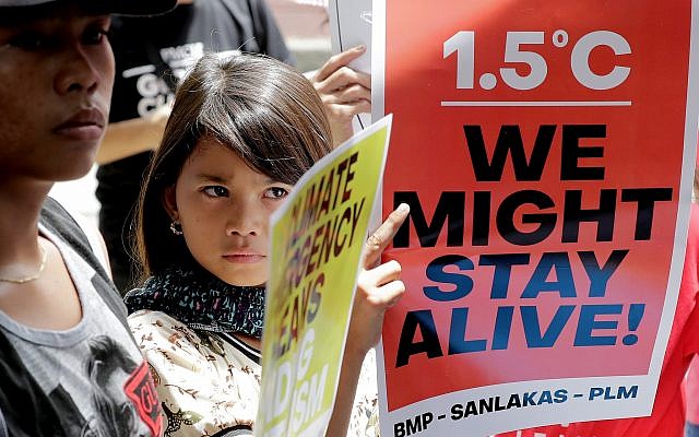 Environmental activists hold placards during a rally outside the Department of Environment and Natural Resources to coincide with the global protests on climate change, Sept. 20, 2019 at suburban Quezon city, northeast of Manila, Philippines (AP Photo/Bullit Marquez) Environmental activists hold placards during a rally outside the Department of Environment and Natural Resources to coincide with the global protests on climate change, Sept. 20, 2019 at suburban Quezon city, northeast of Manila, Philippines (AP Photo/Bullit Marquez)