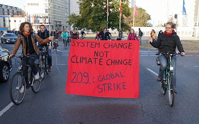 Protesters hold a banner during a bicycle parade in Berlin, Germany, Sept. 20, 2019 as part of the 'Friday For Future' global strike (Kay Nietfeld/dpa via AP) Protesters hold a banner during a bicycle parade in Berlin, Germany, Sept. 20, 2019 as part of the 'Friday For Future' global strike (Kay Nietfeld/dpa via AP)