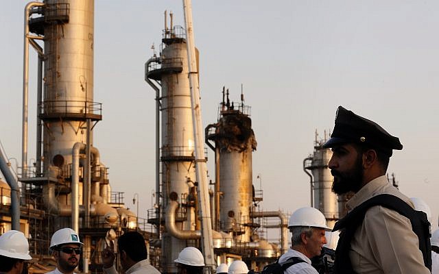 During a trip organized by Saudi information ministry, a security guard stands alert in front of Aramco's oil processing facility after the recent September 14 attack on Aramco's oil processing facility in Abqaiq, near Dammam in the Kingdom's Eastern Province, September 20, 2019. (AP Photo/Amr Nabil) During a trip organized by Saudi information ministry, a security guard stands alert in front of Aramco's oil processing facility after the recent September 14 attack on Aramco's oil processing facility in Abqaiq, near Dammam in the Kingdom's Eastern Province, September 20, 2019. (AP Photo/Amr Nabil)