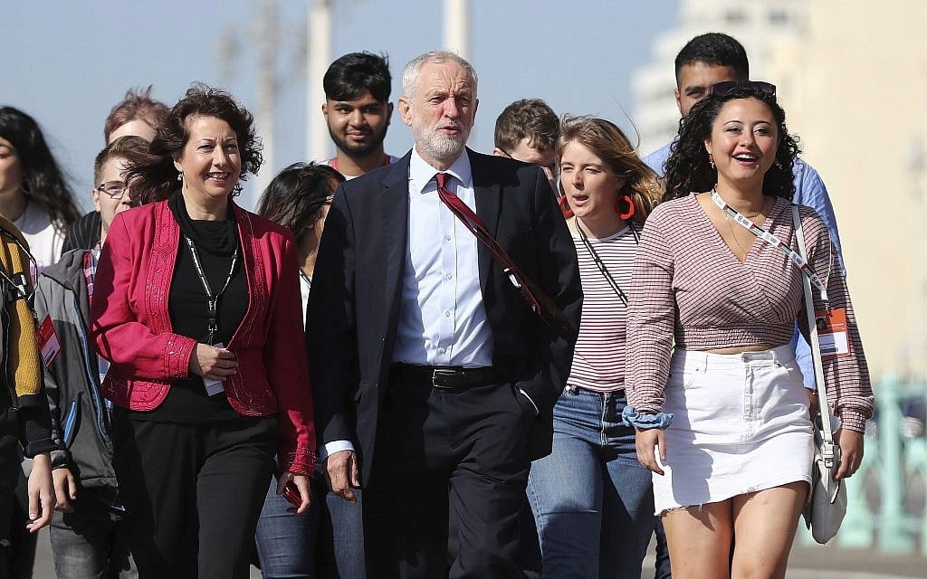 Labour Party leader Jeremy Corbyn, walking along the promenade, arrives for the Labour Party Conference at the Brighton Centre in Brighton, England, September 21, 2019. (Gareth Fuller/PA via AP) Labour Party leader Jeremy Corbyn, walking along the promenade, arrives for the Labour Party Conference at the Brighton Centre in Brighton, England, September 21, 2019. (Gareth Fuller/PA via AP)