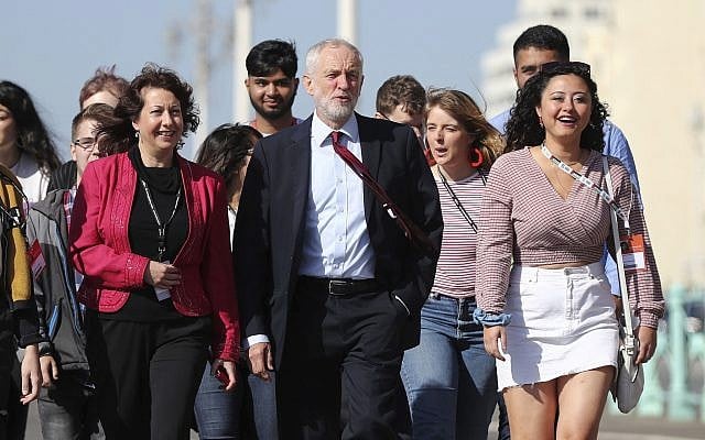 Labour Party leader Jeremy Corbyn, walking along the promenade, arrives for the Labour Party Conference at the Brighton Centre in Brighton, England, September 21, 2019. (Gareth Fuller/PA via AP) Labour Party leader Jeremy Corbyn, walking along the promenade, arrives for the Labour Party Conference at the Brighton Centre in Brighton, England, September 21, 2019. (Gareth Fuller/PA via AP)