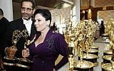 Tony Shaloub and Alex Borstein accept the award for outstanding supporting actor and actress in a comedy series for "The Marvelous Mrs. Maisel" at the 71st Primetime Emmy Awards on Sunday, Sept. 22, 2019, at the Microsoft Theater in Los Angeles. (Photo by Eric Jamison/Invision for the Television Academy/AP Images)