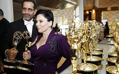 Tony Shaloub and Alex Borstein accept the award for outstanding supporting actor and actress in a comedy series for "The Marvelous Mrs. Maisel" at the 71st Primetime Emmy Awards on Sunday, Sept. 22, 2019, at the Microsoft Theater in Los Angeles. (Photo by Eric Jamison/Invision for the Television Academy/AP Images)