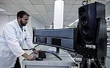 Ariel Gomez, a systems engineer at Israel Aerospace Industries, works on the Popstar system at Israel Aerospace Industries, in the town of Yehud, September 9, 2019. (AP Photo/Tsafrir Abayov)