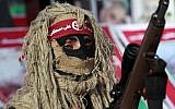 Illustrative: A gunman from the Popular Front for the Liberation of Palestine (PFLP) terror group participates in a rally at the Jabaliya Refugee Camp, in the northern Gaza Strip, March 7, 2014. (AP Photo/Adel Hana)