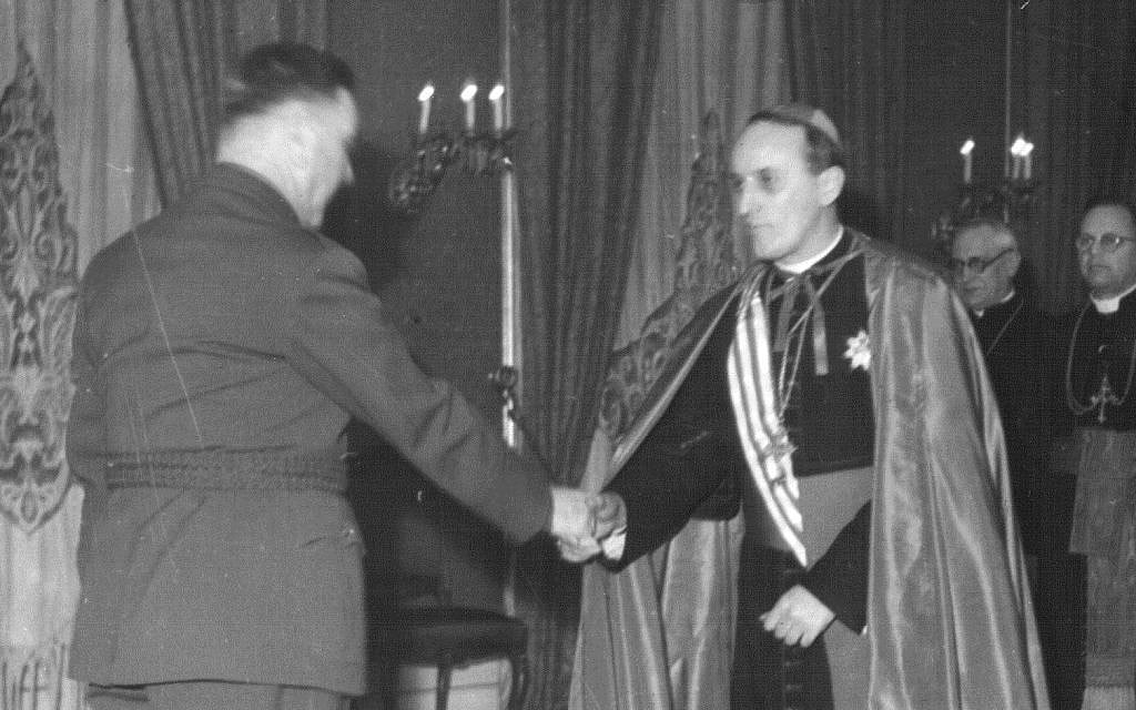 Aloysius Stepinac, right, shakes hands with Ustasha leader Ante Pavelić. (Public domain)