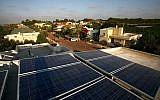 Power-generating solar panels on the rooftop of a house in central Israel. (Chen Leopold / Flash 90