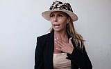 Inbal Or, a former residential real estate developer whose empire collapsed following her arrest on allegations of fraud and tax evasion, holds a press conference in Tel Aviv, July 29, 2018. (Tomer Neuberg/FLASH90)