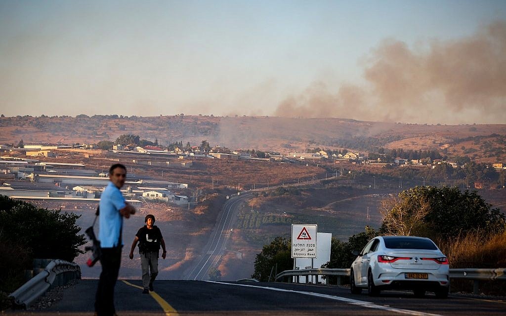 Smoke rises from a fire caused from a rocket fired from Lebanon near Moshav Avivim on the border with Lebanon, in northern Israel, September 1, 2019. (David Cohen/Flash90)