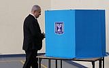 Prime Minister Benjamin Netanyahu votes at a polling station in Jerusalem on September 17, 2019. (Alex Kolomoisky/Pool/Flash90)