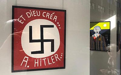 Painting by Fatmir Limani featuring a large swastika at the Bog-Art gallery in Brussels, Belgium. (LBCA via JTA)