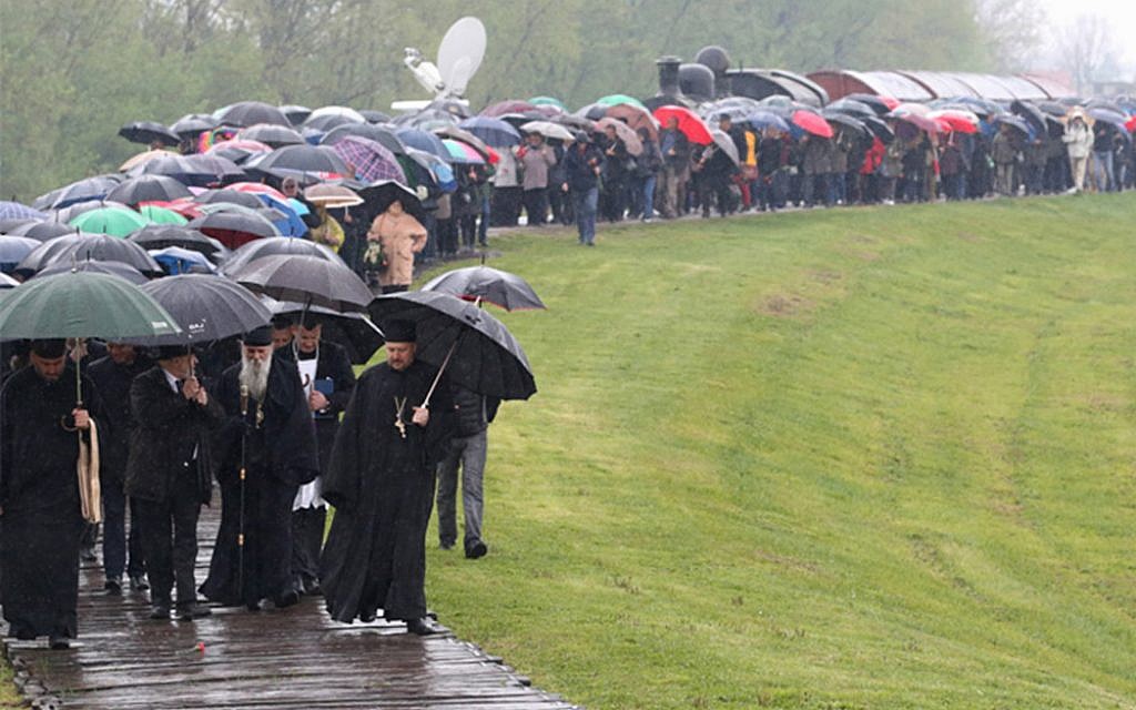 Groups of Jewish, Serb, Roma, and Croat anti-fascist survivors make a pilgrimage to the Jasenovac site in 2019 to make sure what happened at the death camp is never forgotten. (Credit: Jasenovac: Auschwitz of the Balkans)